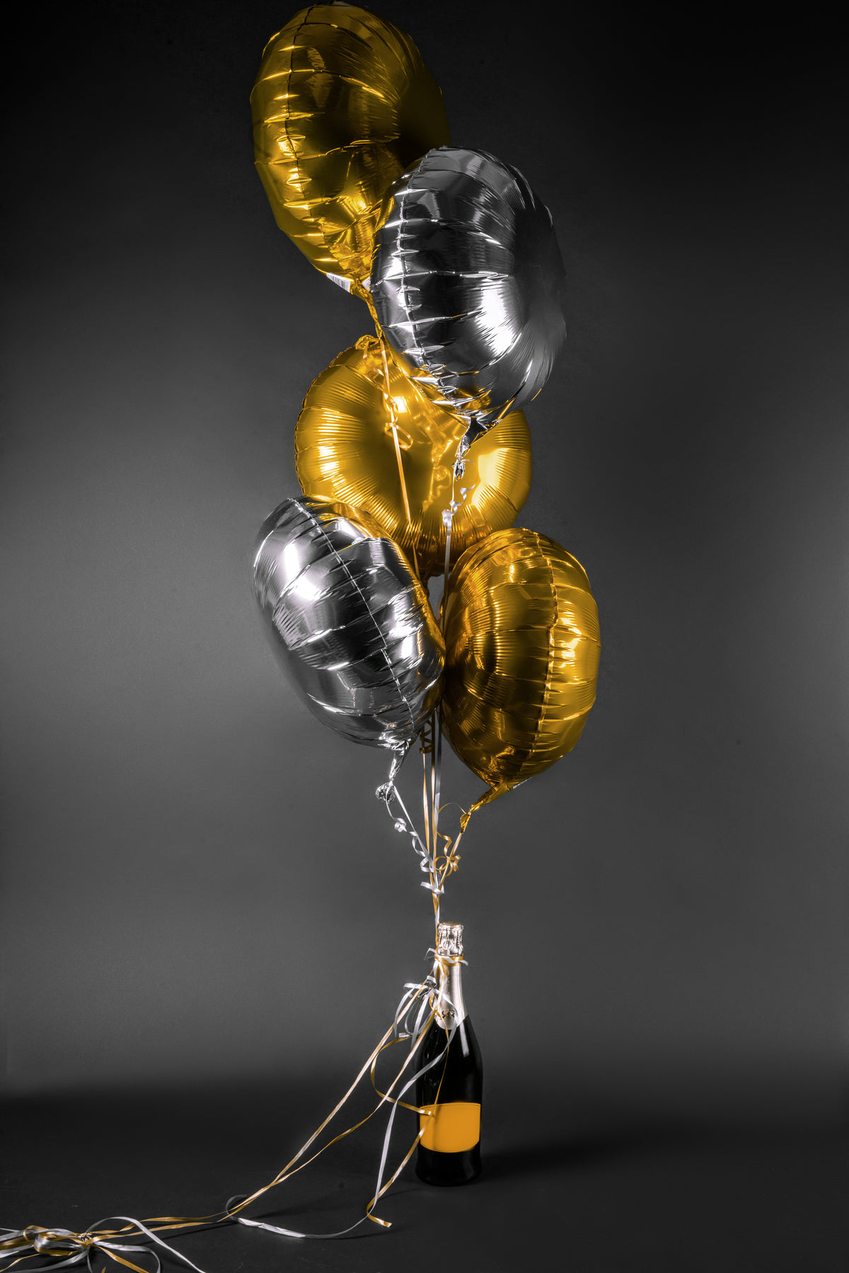 celebrate with champagne and balloons