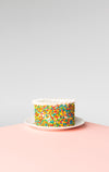 celebration cake on pink surface