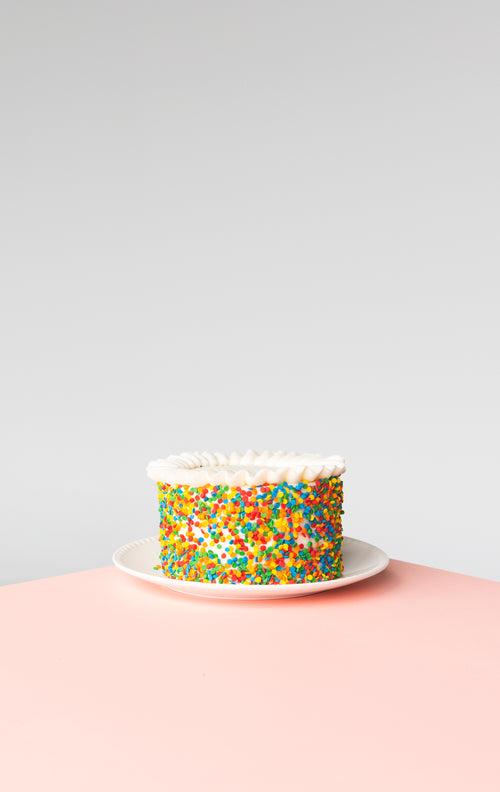celebration cake on pink surface