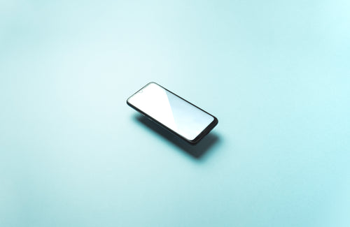 cellphone floats above light blue background