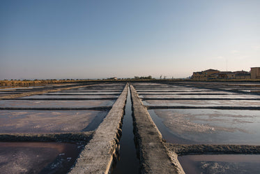 cement grid with pools of water and salt