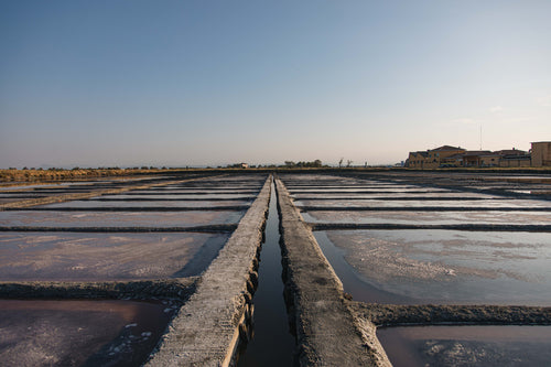 cement grid with pools of water and salt