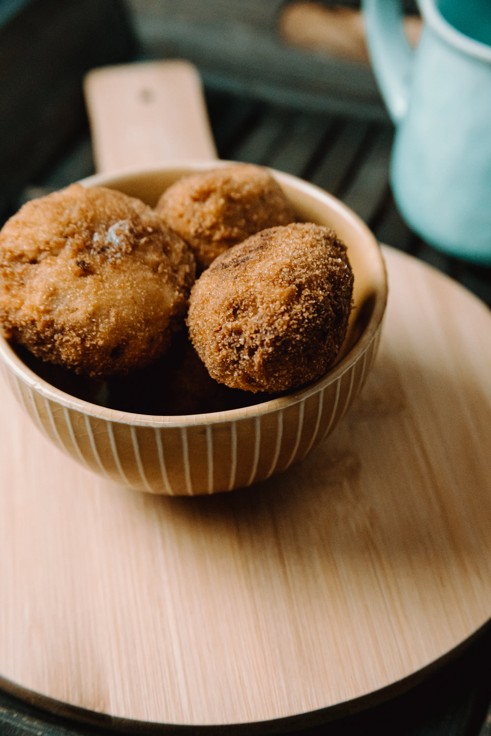 ceramic bowl filled with cooked brown balls