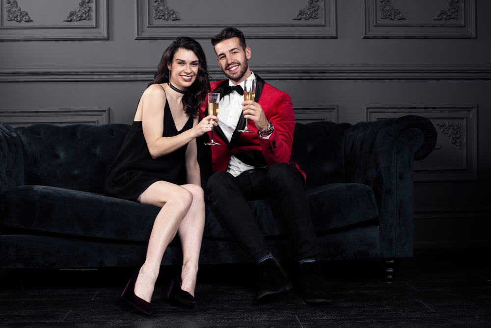 champagne cheers with well-dressed couple