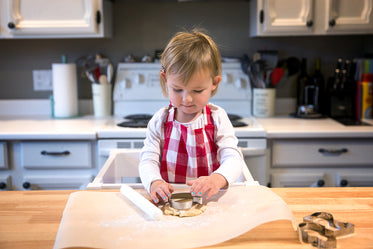 child makes cookies