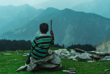 child sits enjoying the view