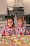 children decorate cookies
