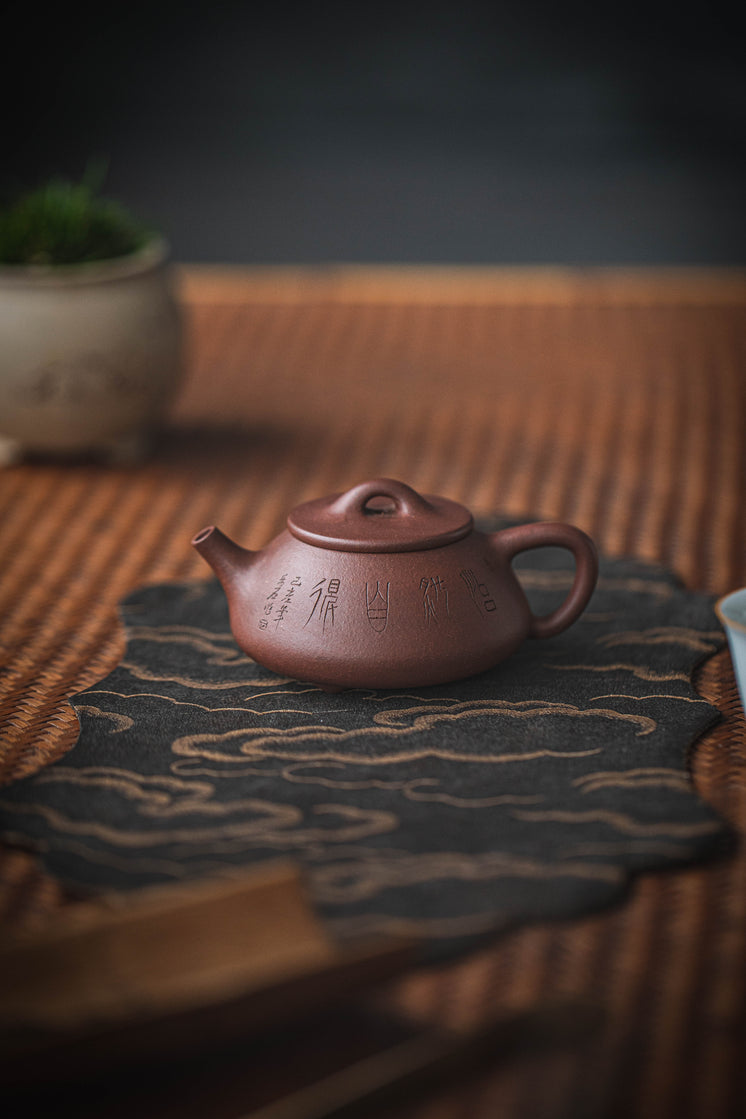 Chinese Teapot On A Bamboo Surface