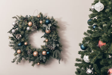 christmas wreath hung by the tree with care