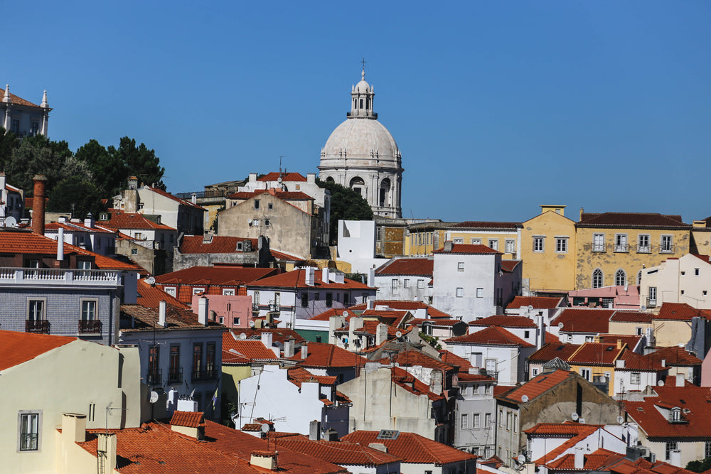 church spire over lisbon rooftops