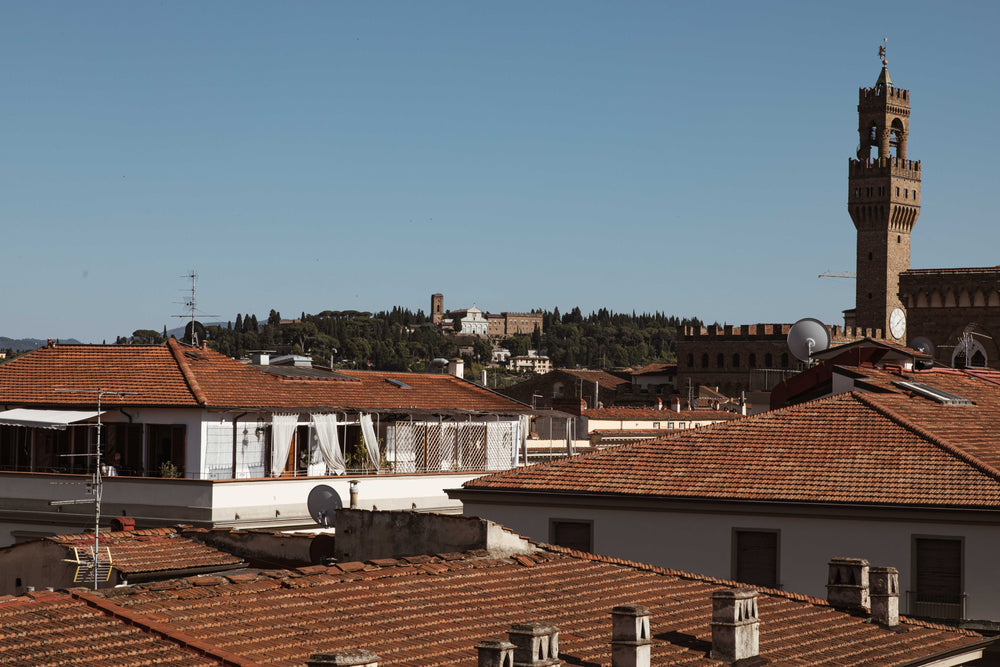 church spire over terracotta rooftops