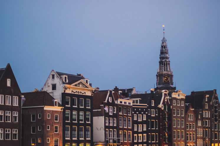 church-tower-over-terraced-buildings.jpg