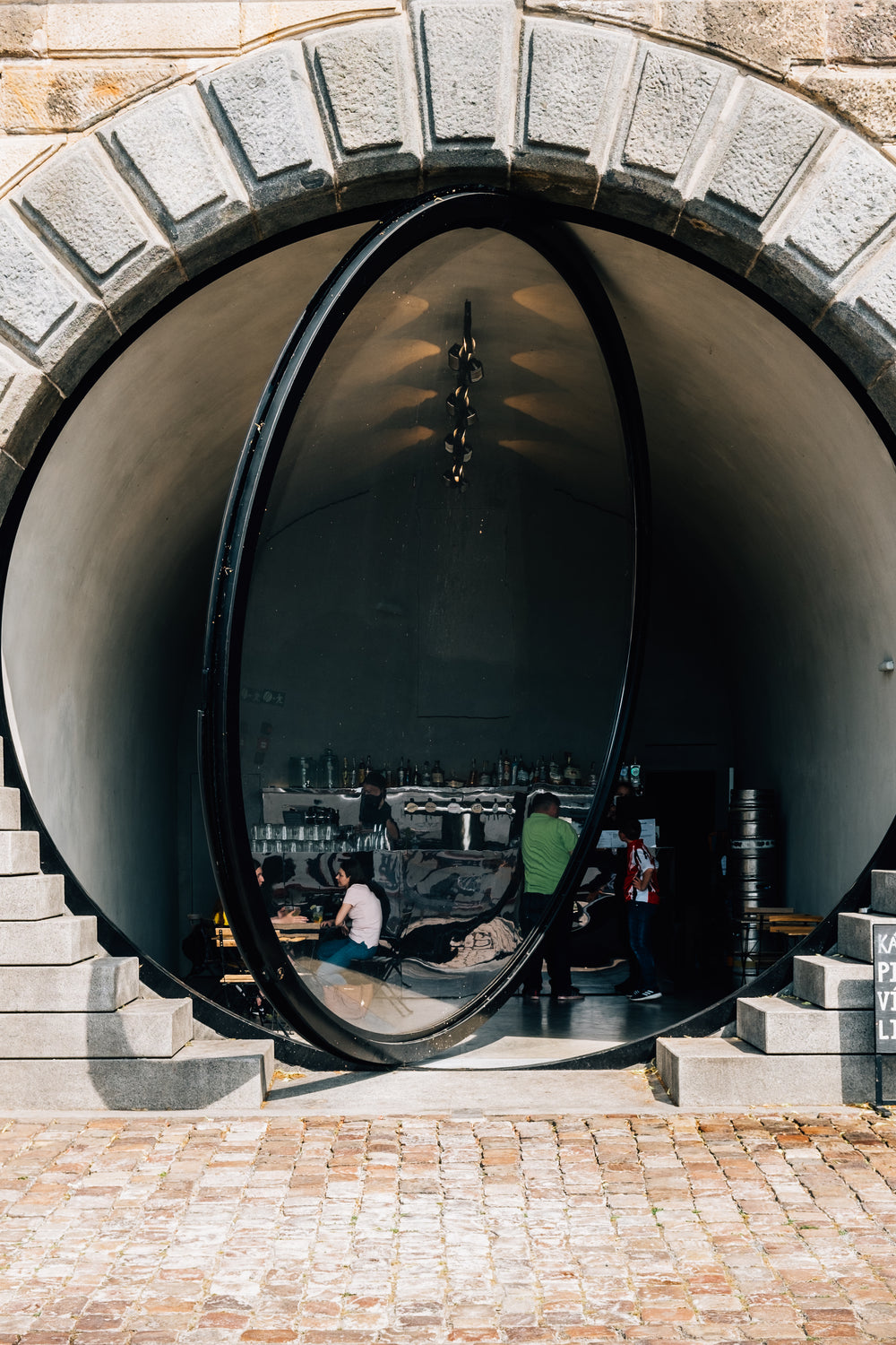 circular glass doorway of a restaurant