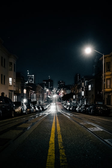 city road with tracks at night