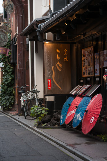 city street with umbrellas outside a restaurant