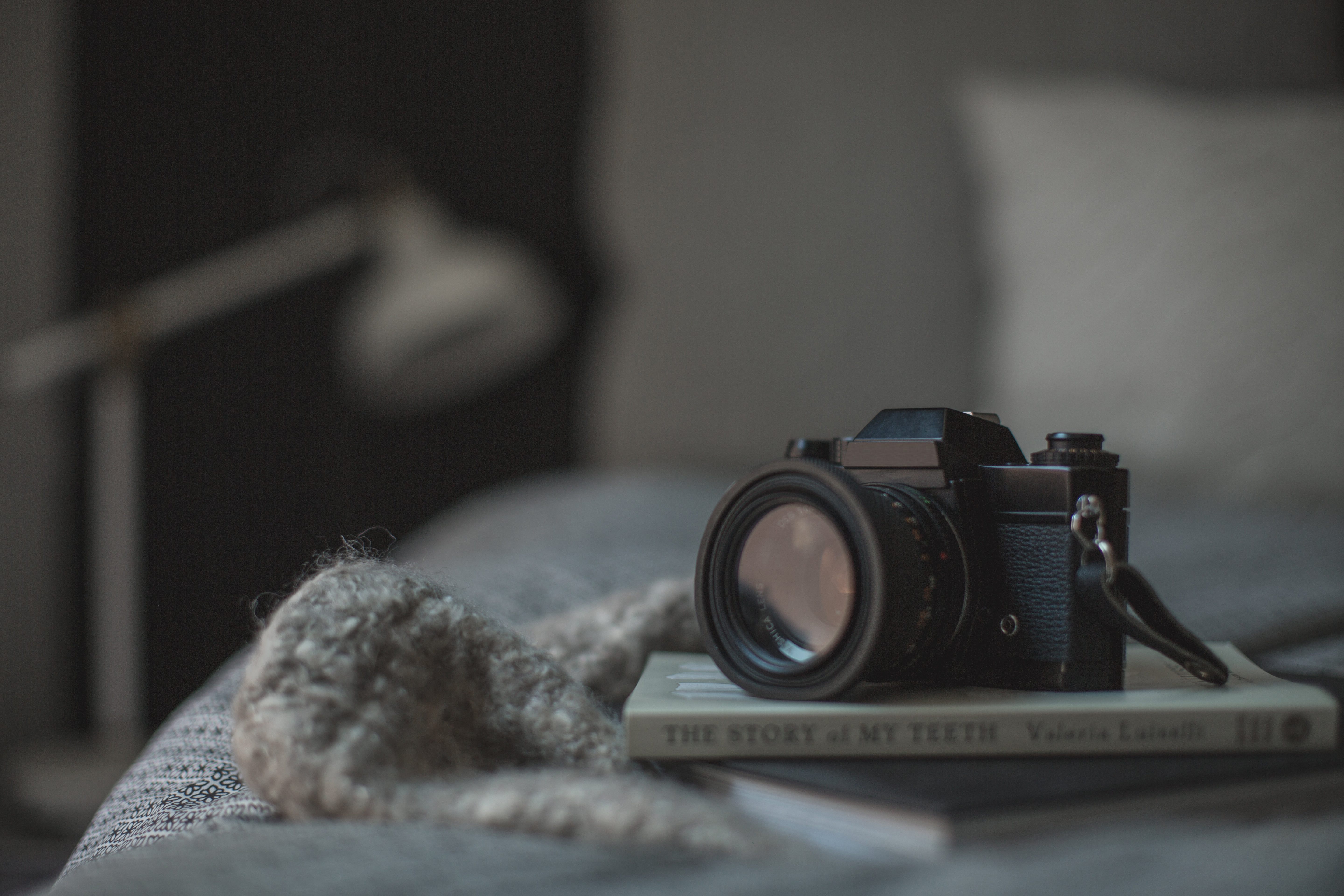 Classic Camera Resting On Book