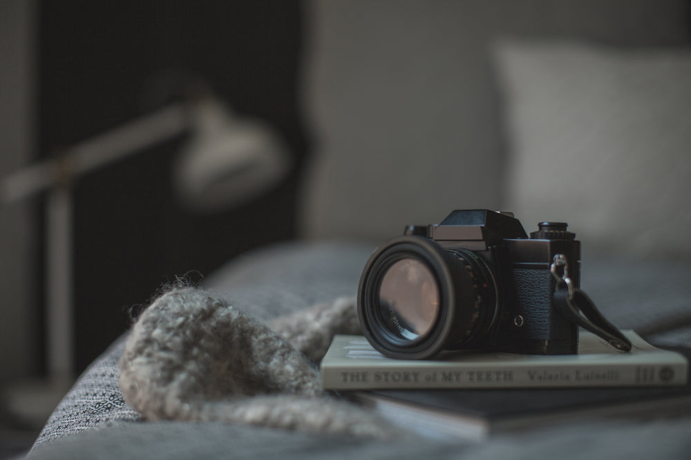 classic camera resting on book