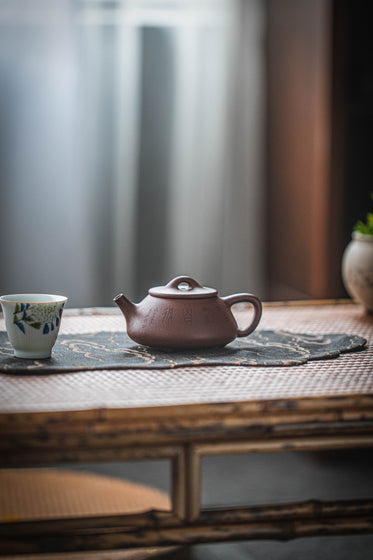 Clay Teapot And Teacup On The Table