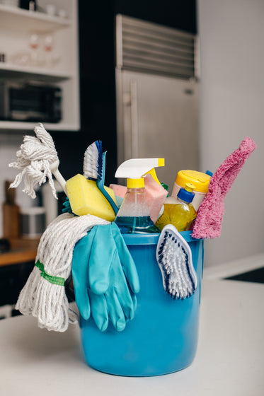 cleaning supply bucket in kitchen