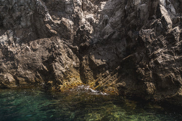 clear blue water on rock side