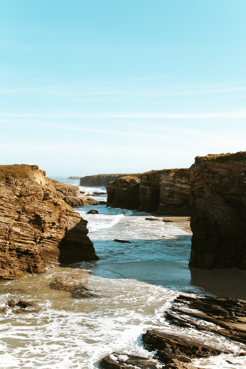 cliffs form shadows by the sea