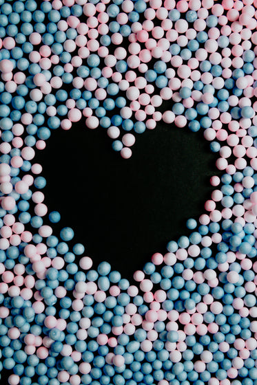 close up blue and pink balls create a heart