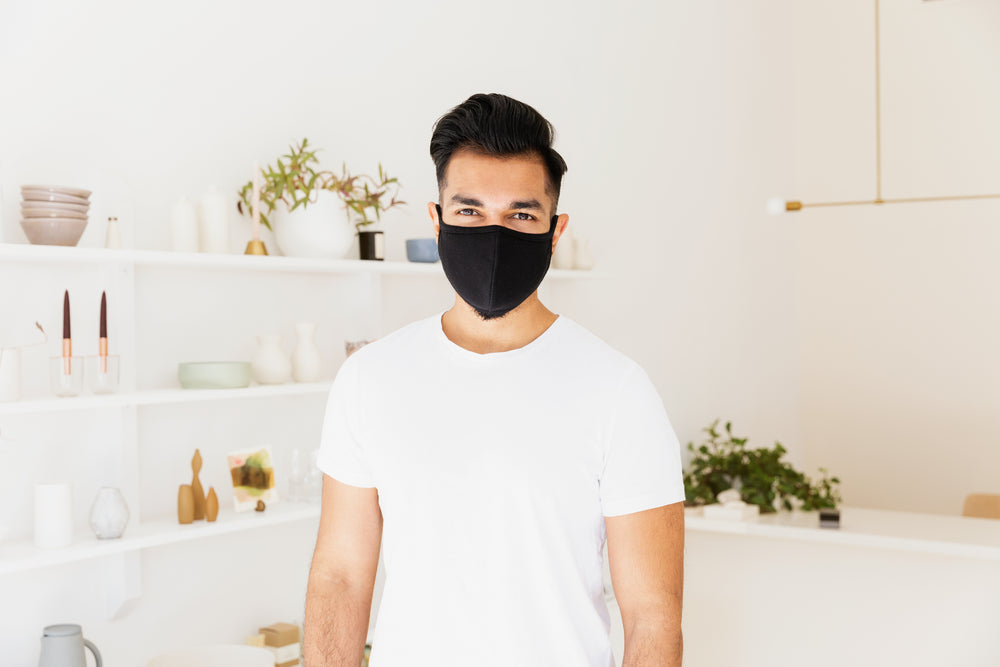 close up man stands in front of merchandise