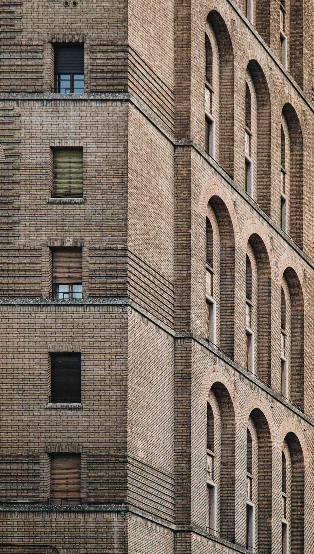 close up of a brown brick building with windows