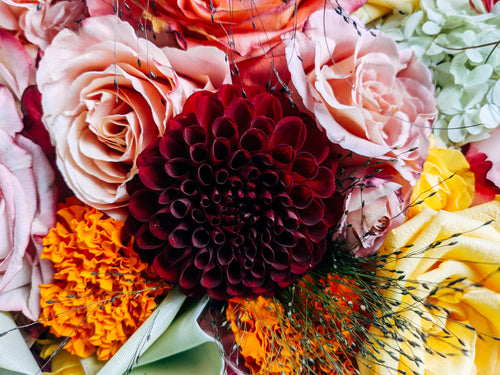 close up of a floral arrangement with a variety of flowers