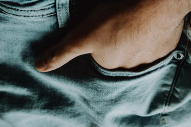 close up of a hand in a jean pocket