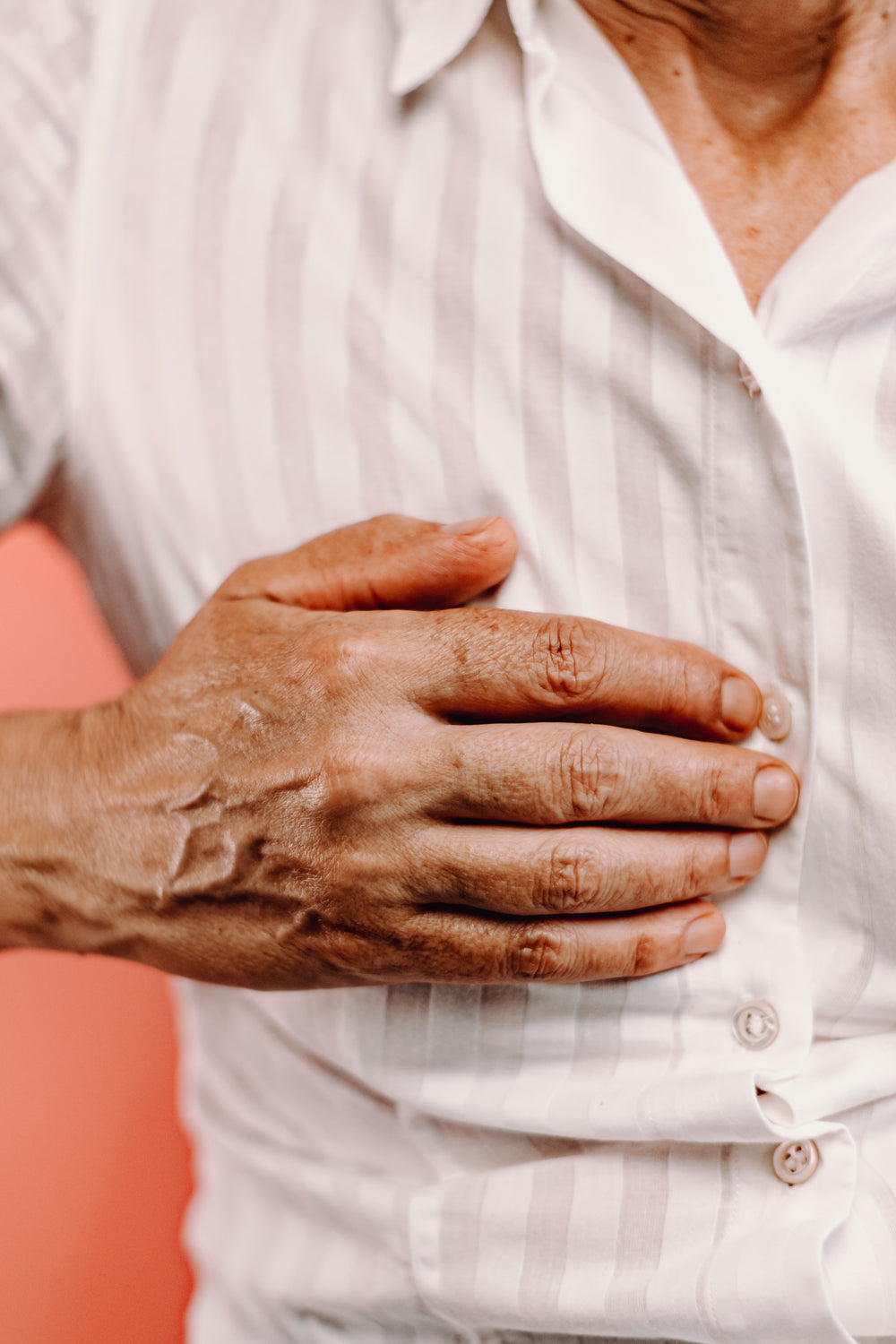 close up of a hand on a chest