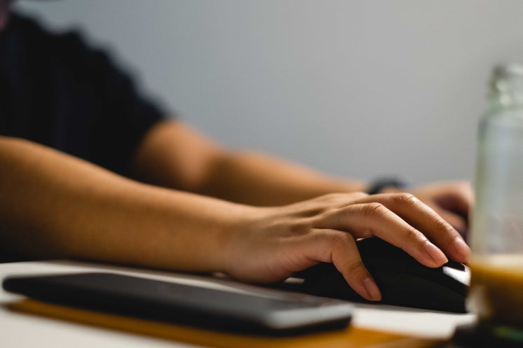 Close Up Of A Hand Using A Computer Mouse