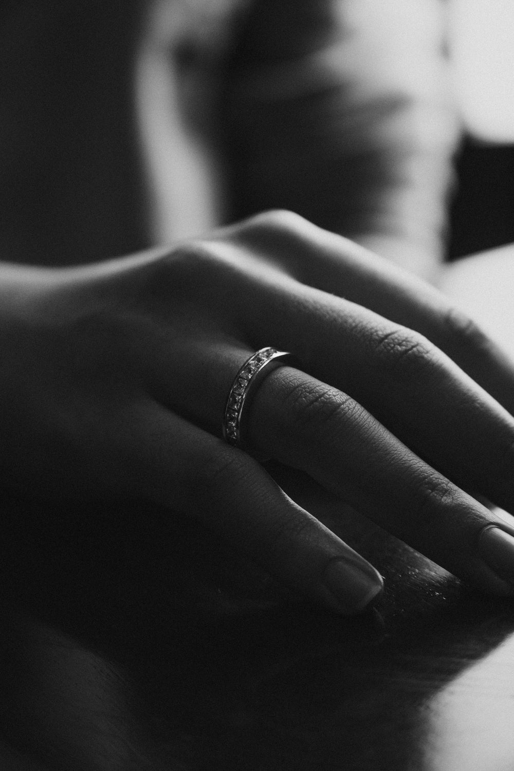 close up of a hand with a ring on it