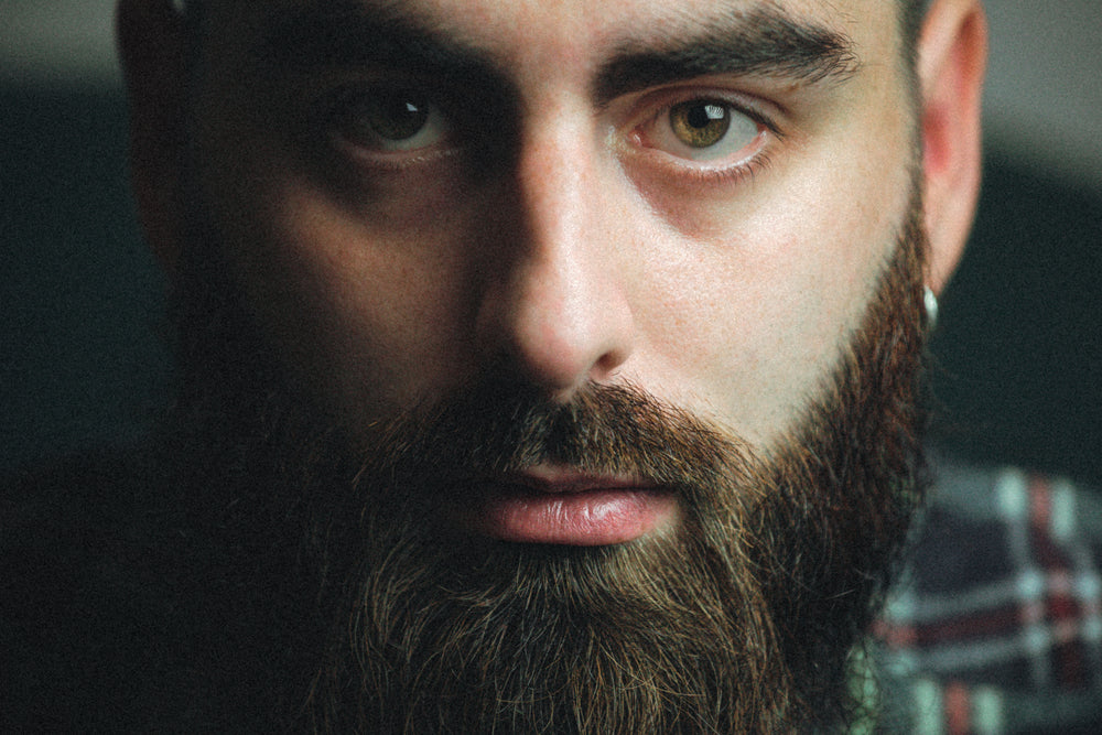 close up of a mans face in frame