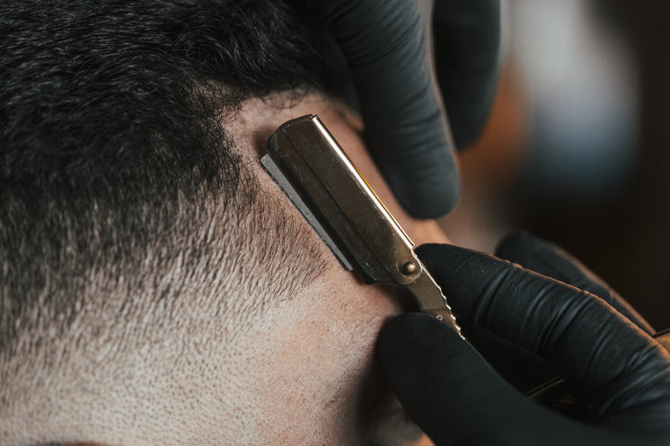 Close Up Of A Straight Razor In Use