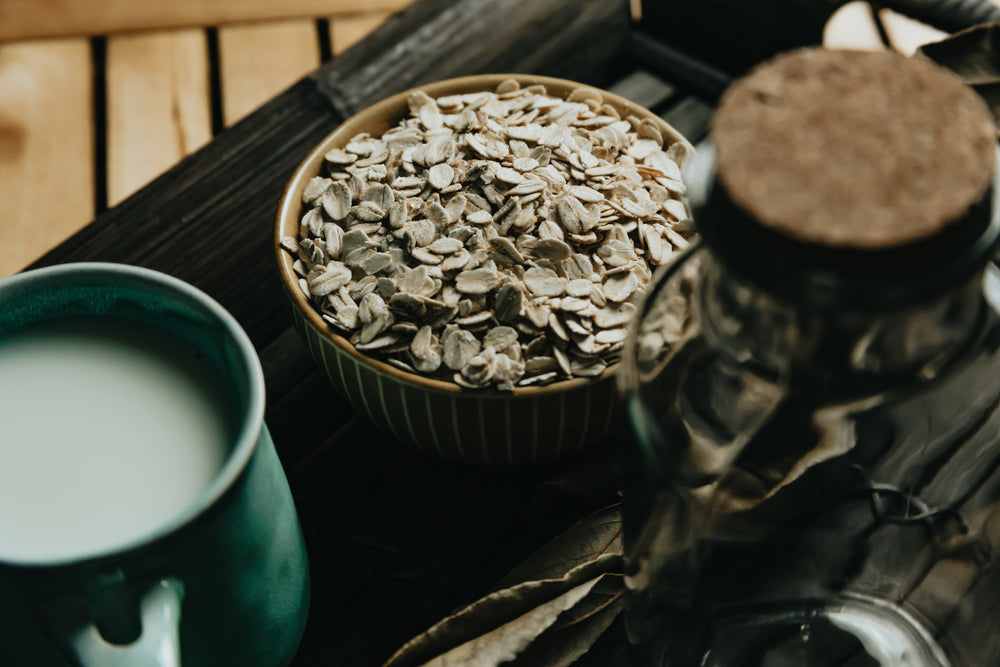 close up of breakfast oats in a ceramic bowl