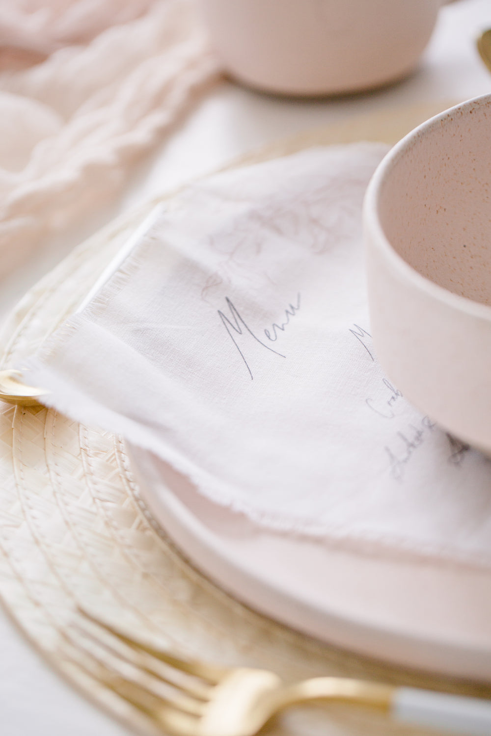 close up of calligraphy on white fabric