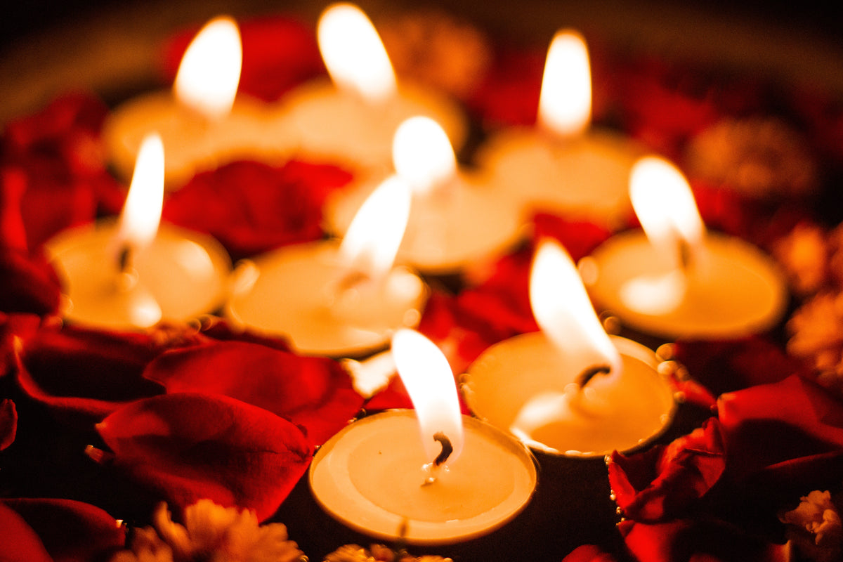 close up of candles and petals