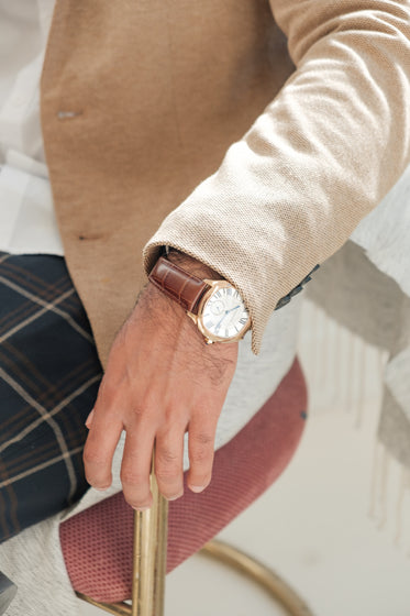 close up of classic gold and leather watch