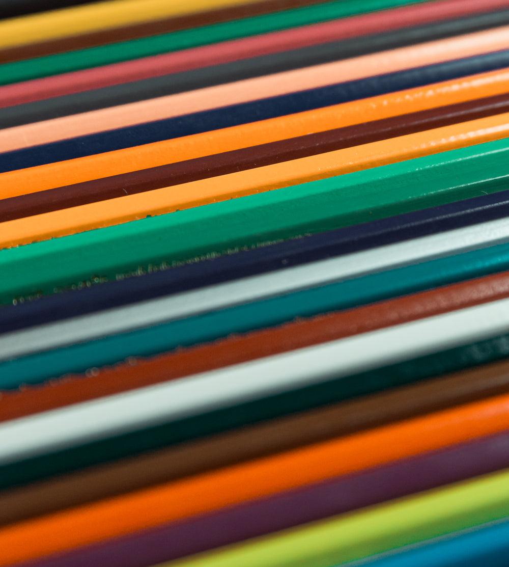 close up of colored pencils lined up