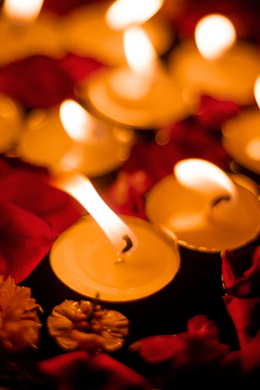 close up of lit white tea light candles