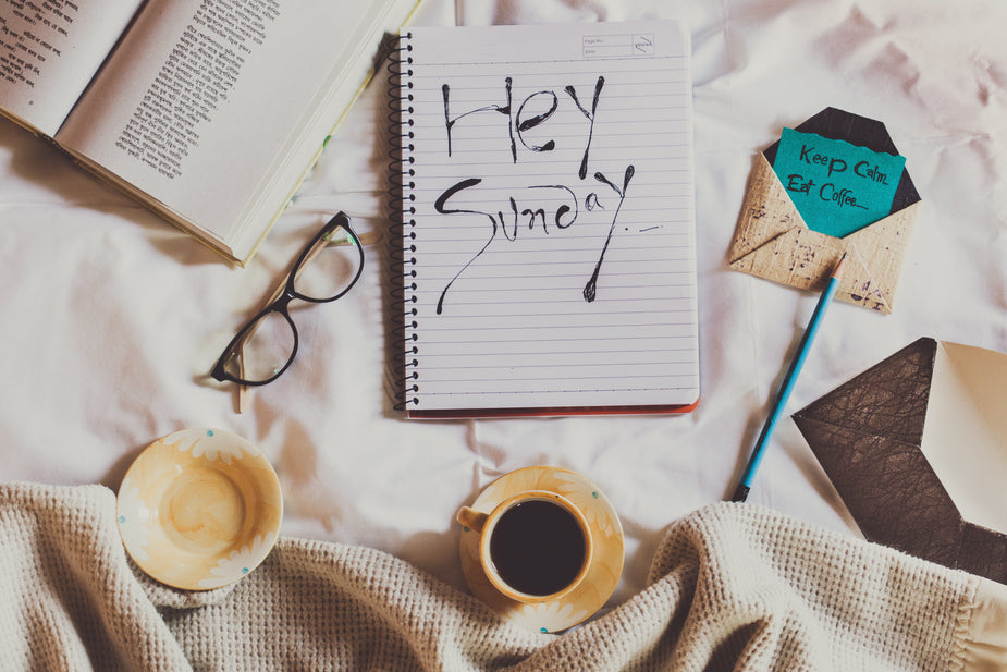 Browse Free HD Images of Close Up Of Notebook With Hey Sunday Written