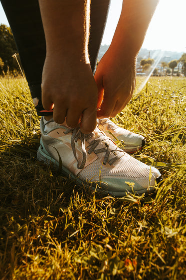 close up of person tying their shoe