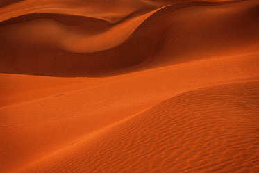 Close Up Of Wavy Orange Curving Sand Dunes