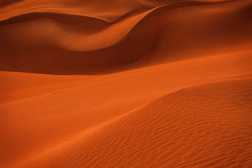 Close Up Of Wavy Orange Curving Sand Dunes