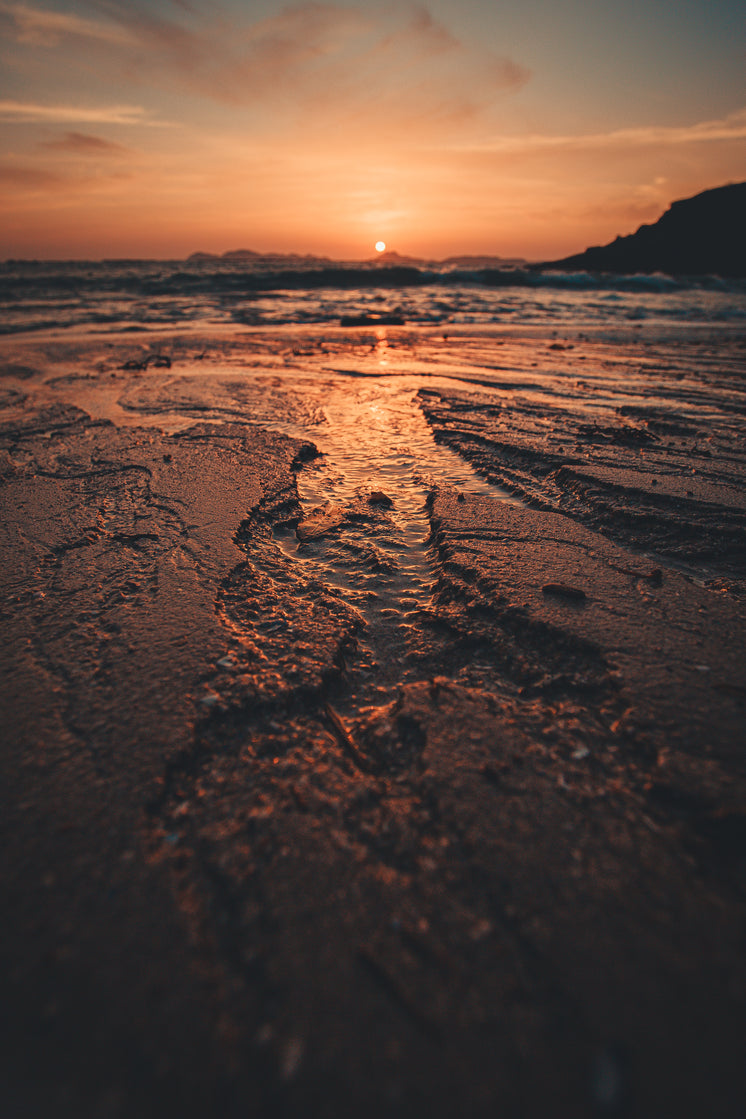 close-up-orange-tide-rolls-into-shore.jp