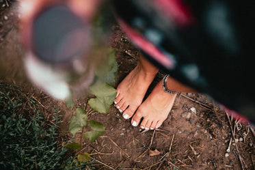 close up shot woman's feet and anklet