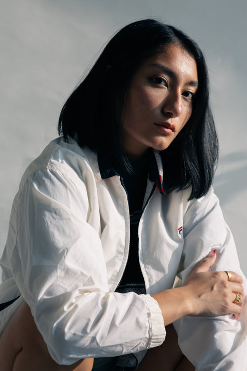 close up woman posing in white casual jacket