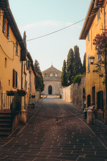 closed driveway to an old stone church