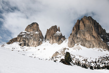 clouds drift over mountain peaks